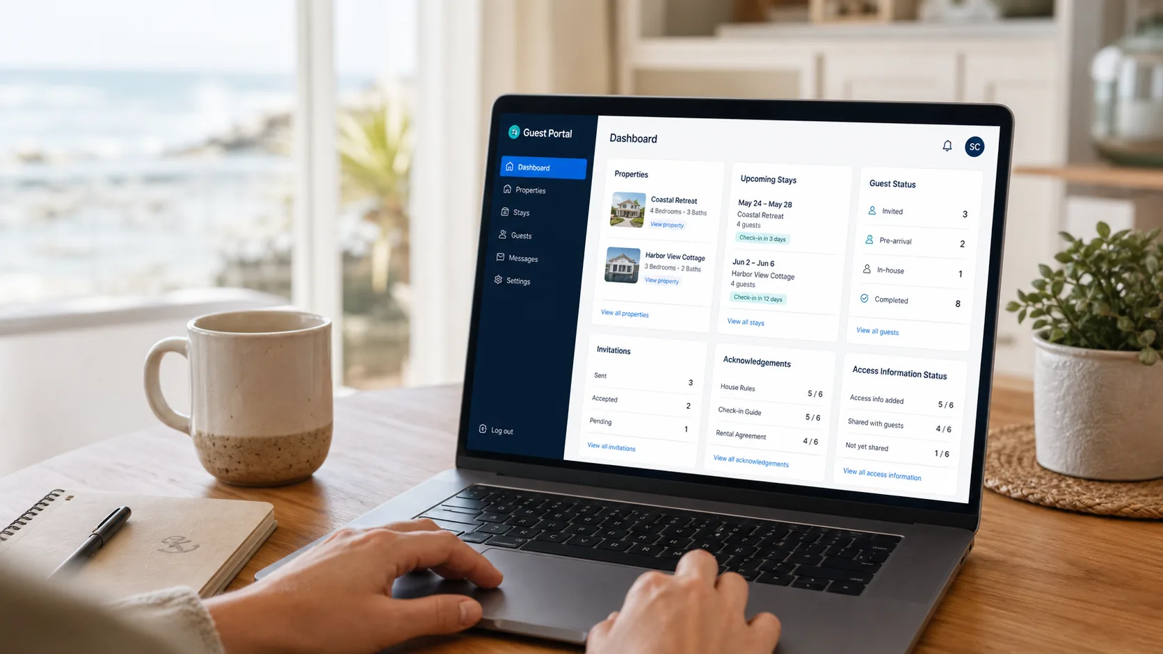 Guest Portal owner dashboard displayed on a laptop in a coastal home workspace.